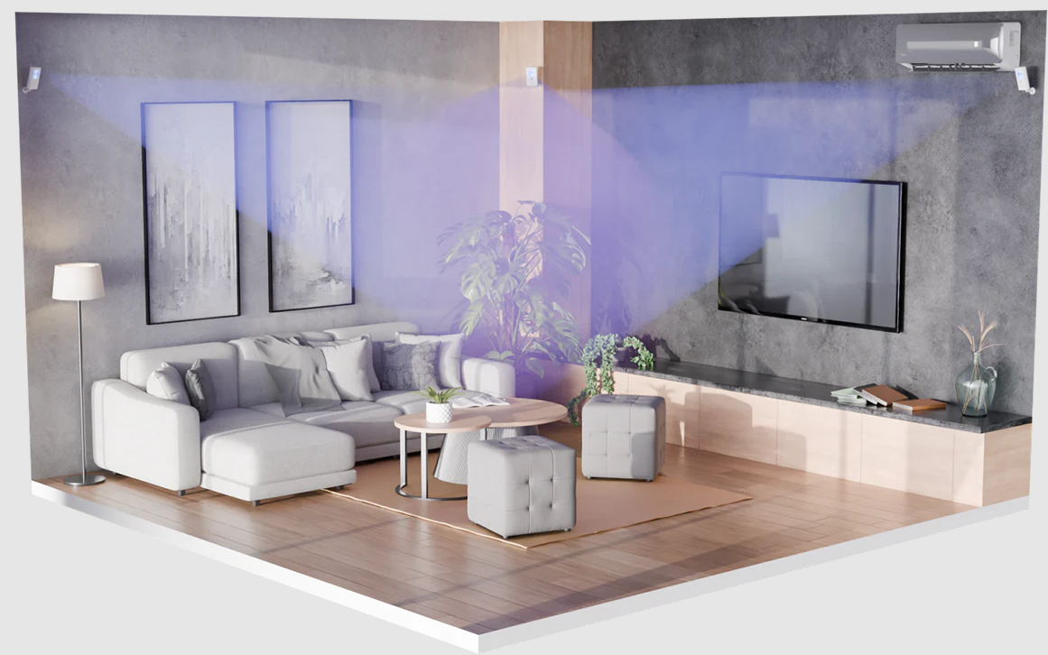 concept image of a living room with couches. two uvc lights are mounted at opposite sides of the room near the ceiling facing one another. faux uv light beams are shown